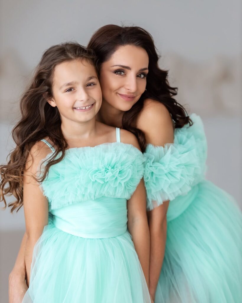 Mother-and-daughter photoshoot in matching mint dresses